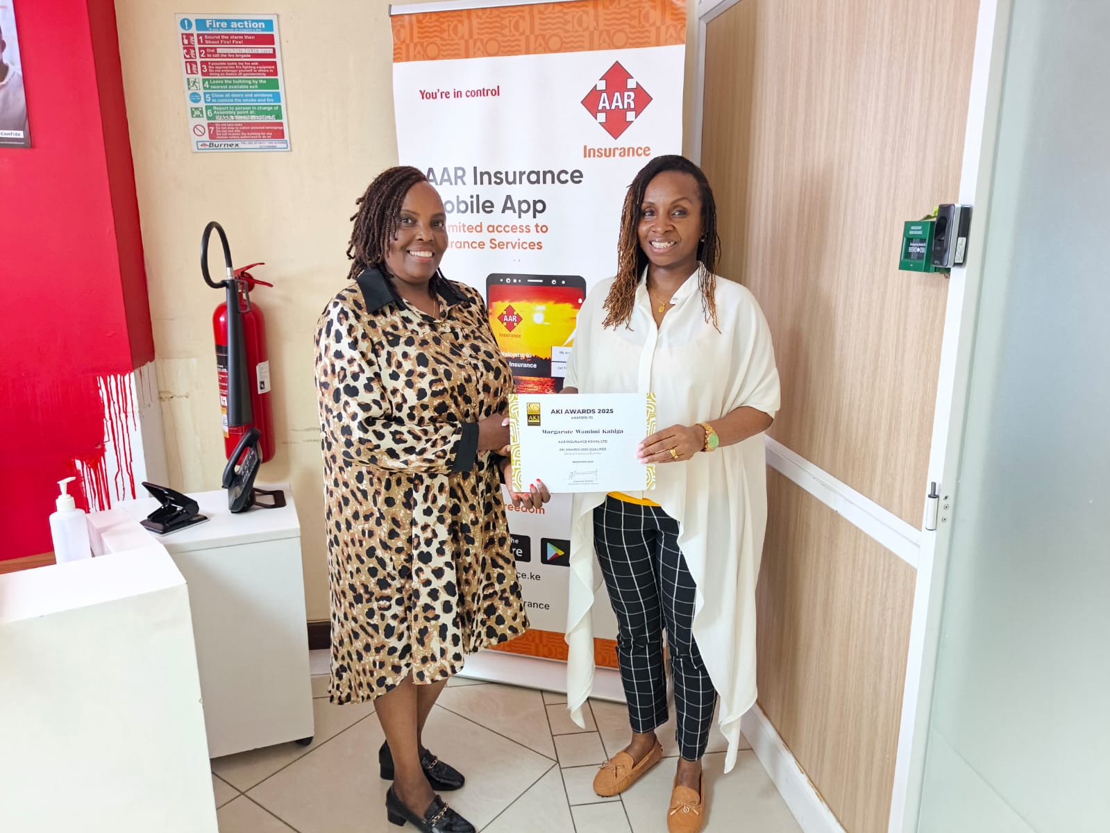 Maggie receiving AKI certificate from AAR